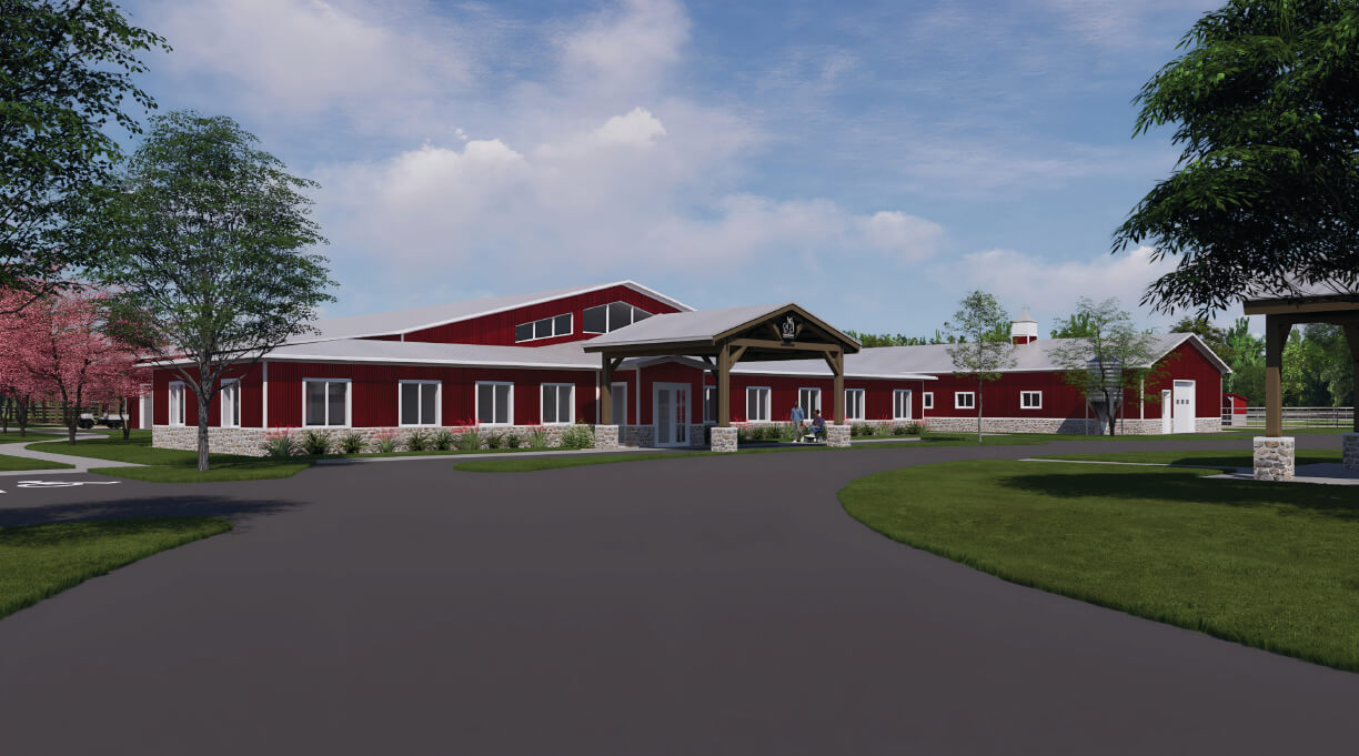 Red barn-style building with surrounding trees.